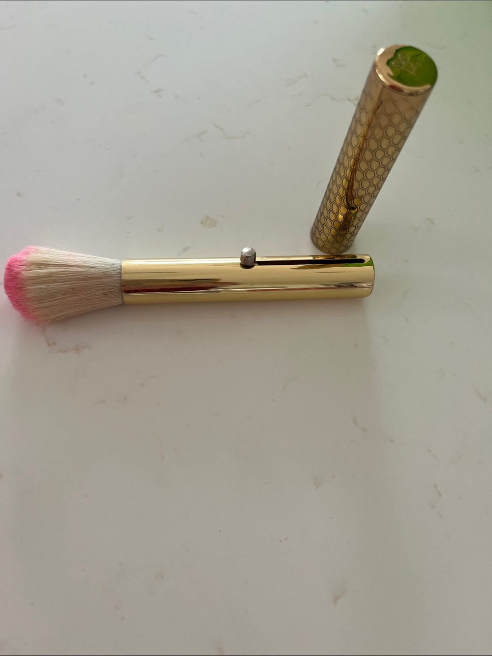 Guerlain Gold retractable brush.